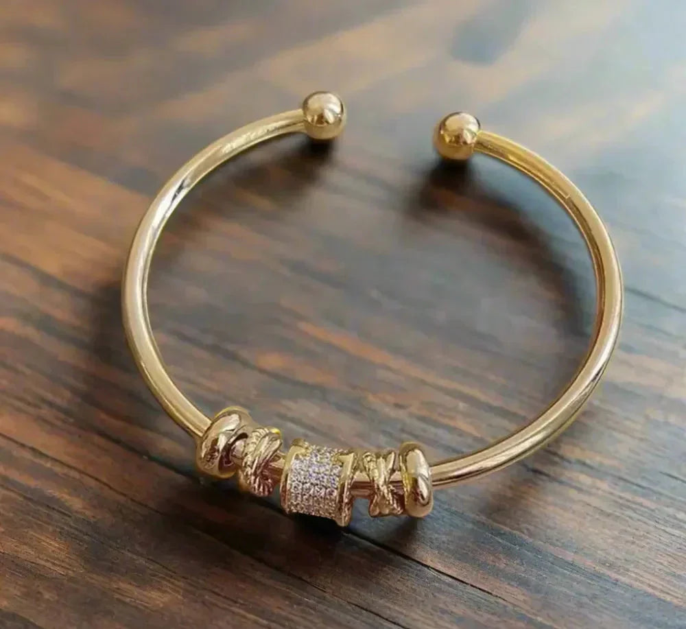 Adjustable bracelet with golden charms 0