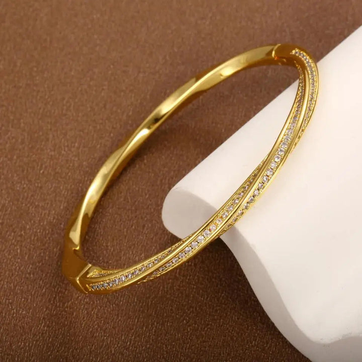 Elegant crystal bracelet with two rows of gold detailing. 0